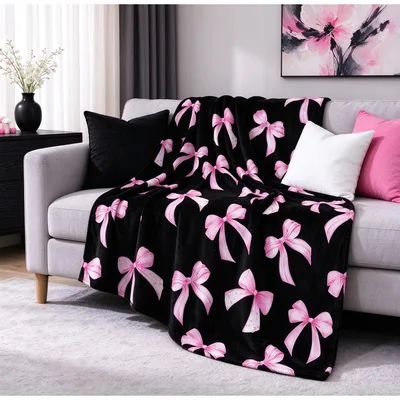 Pink Bow Pattern on Black Blanket: Bold Ribbon Design for Your Sofa