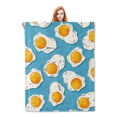 Sunny Side Up Eggs Blanket featuring a playful pattern of fried eggs