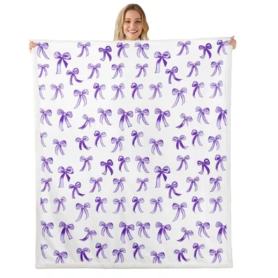 Purple Bow Pattern Blanket: A Scattered Ribbon Design for Soft Spaces