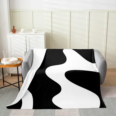 Black and White Wave Blanket featuring bold abstract fluid shapes