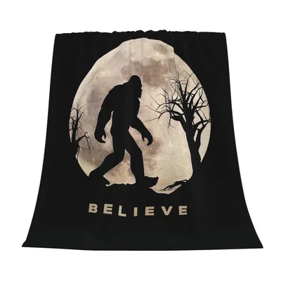 Believe Bigfoot Full Moon Blanket features a silhouetted