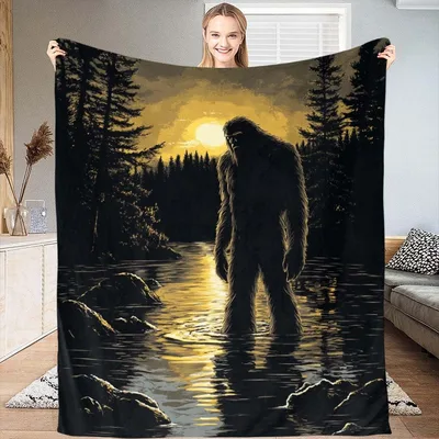 Bigfoot Silhouette at Sunset Blanket: A Mysterious Lake Scene