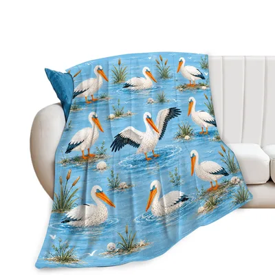 Pelicans on Blue Coastal Blanket featuring white birds