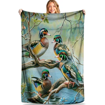 Wood Ducks on Lakeside Blanket: Vibrant Birds Perched on Branches