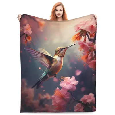 Hummingbird Among Pink Blossoms Blanket features a detailed