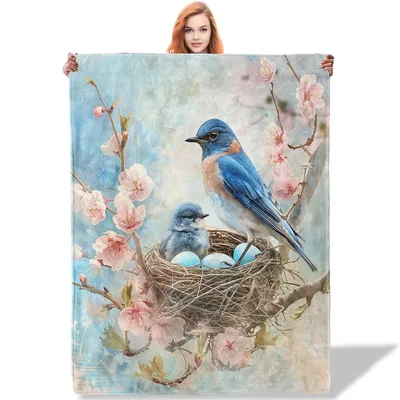 Bluebird Nest on Blossom Blanket featuring a vibrant blue bird