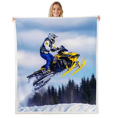 Snowmobile Jumping Through Snow Blanket features a yellow