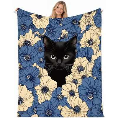 Black Cat Among Blue Blanket: A Feline Peeking Through Flowers