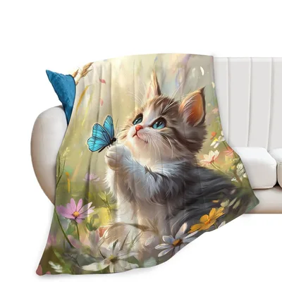 Kitten with Blue Butterfly Blanket: A Curious Feline and Meadow Art