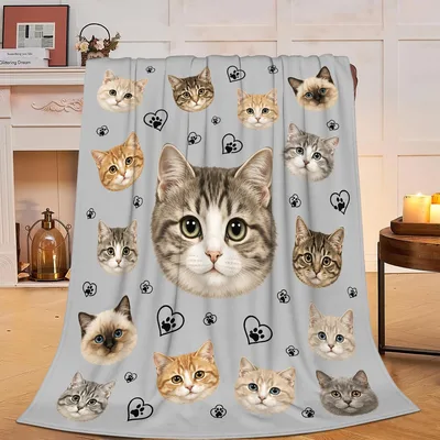 Cat Faces Pattern on Gray Blanket: A Collage of Kitten Portraits