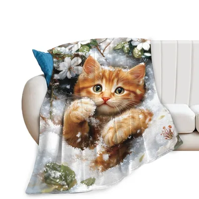 Cute Kitten in Snow Blanket: Ginger Cat Playing in Winter Flowers