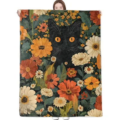 Black Cat in Autumn Blanket features a feline face