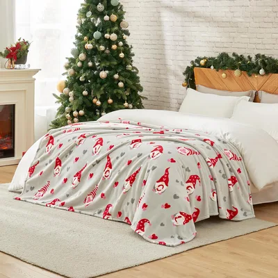 Christmas Gnome Blanket featuring a cute pattern of red-hatted gnomes