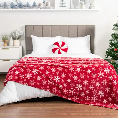 White Snowflake Pattern Blanket features a vibrant red