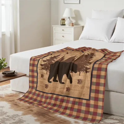 Bear Silhouette on Plaid Blanket featuring a walking bear pine trees