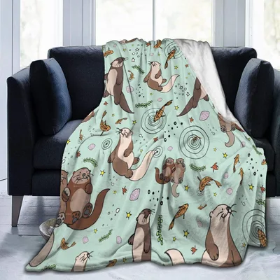 Sea Otters on Mint Blanket: Playful Marine Life Design