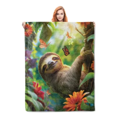 Sloth Hanging in Rainforest Blanket features a smiling sloth