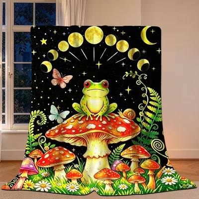 Frog on Mushroom Moon Blanket features a green frog