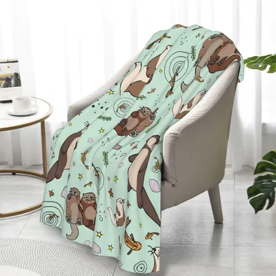 Sea Otters on Mint Green Blanket featuring playful marine mammals