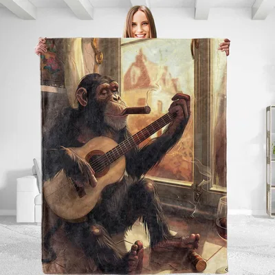 Monkey Playing Guitar Blanket featuring a relaxed chimpanzee