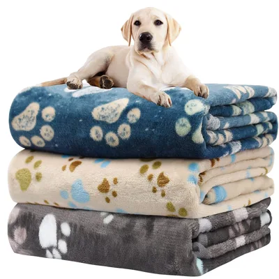 Paw Print Blanket with a Pup Lounging on Top