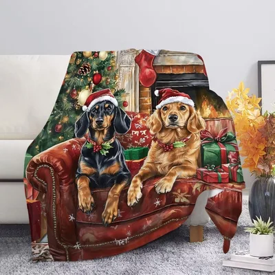 Dogs in Santa Hats on Couch Blanket featuring a dachshund