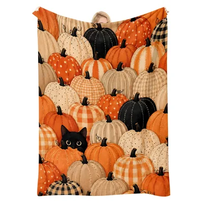 Pumpkins and Black Cat Blanket featuring a patchwork pumpkin pattern