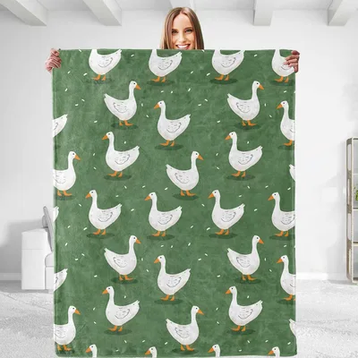 Goose Lover Blanket with a Pattern of White Geese on Green