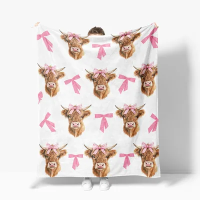 Highland Cows with Pink Blanket: Shaggy Cattle Adorned with Bows