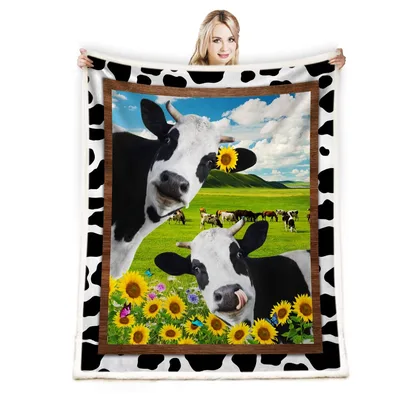 Cows in Sunflower Field Blanket featuring playful spotted cows