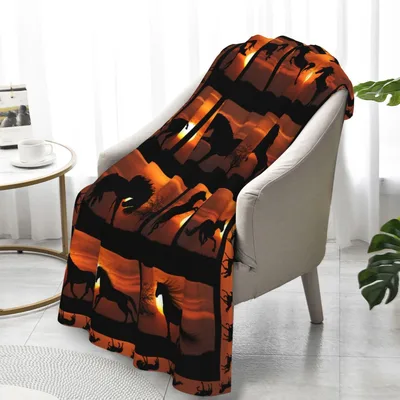 Horses at Sunset Blanket: Wild Equine Silhouettes Against Orange Skies