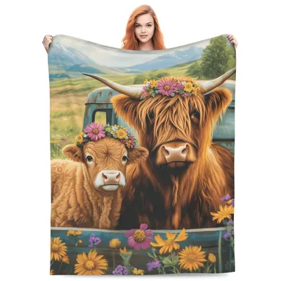 Highland Cow with Flower Blanket: Shaggy Cattle in a Rustic Truck