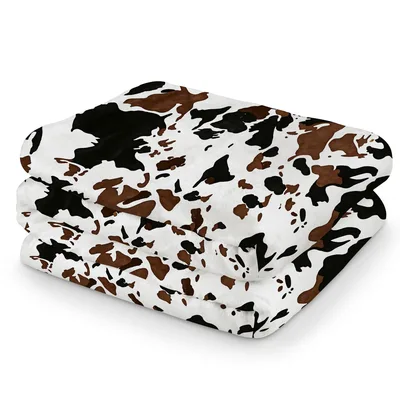 Cow Print Brown Western Blanket featuring classic black