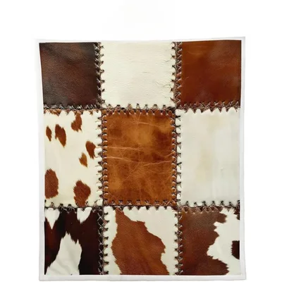 Cowhide Patchwork Pattern Blanket featuring stitched brown