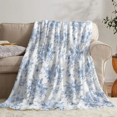 Blue Toile Blanket featuring intricate blue floral motifs