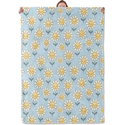 Yellow Daisies on Blue Blanket: Smiling Flower Pattern for Cozy Spaces