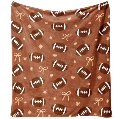 Footballs and Bows Pattern Blanket featuring brown footballs