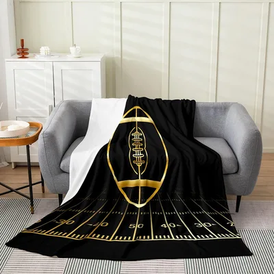 Golden Football on Field Blanket featuring a large gold ball