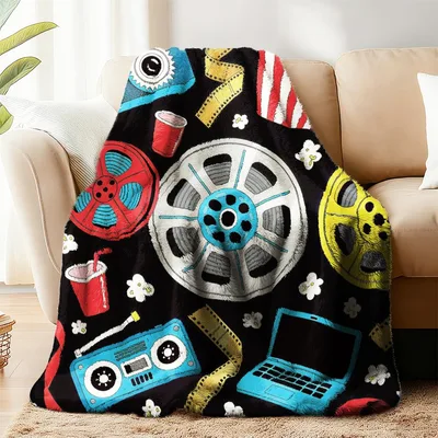 Cinema Reels on Black Blanket for Movie Lovers and Home Theater Fans