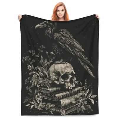 Raven Perched on Skull Blanket: Gothic Art with Books and Flowers