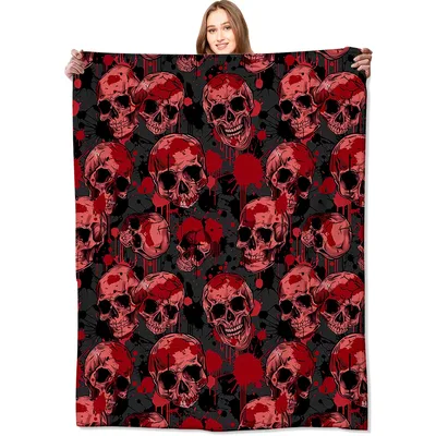 Red Skulls Pattern Blanket featuring crimson grinning skulls