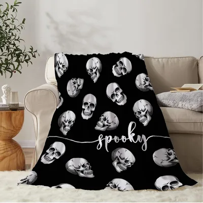 Spooky Skulls Halloween Blanket features a black background