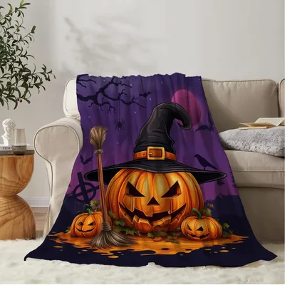 Halloween Pumpkin Witch Blanket featuring a jack-o-lantern
