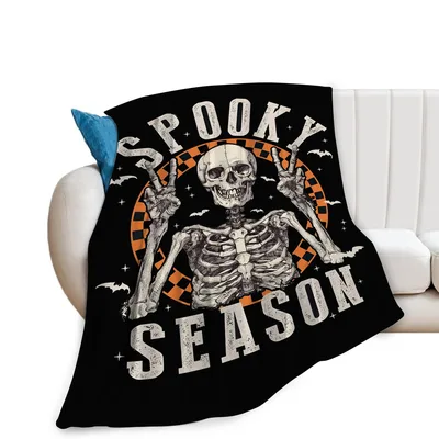 Spooky Season Skeleton Blanket: Rocking Skull Design for Halloween