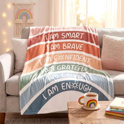 Positive Affirmation Blanket featuring rainbow stripes