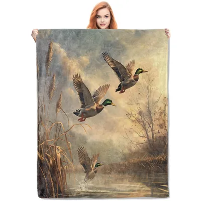 Mallard Ducks Taking Flight Blanket features realistic male