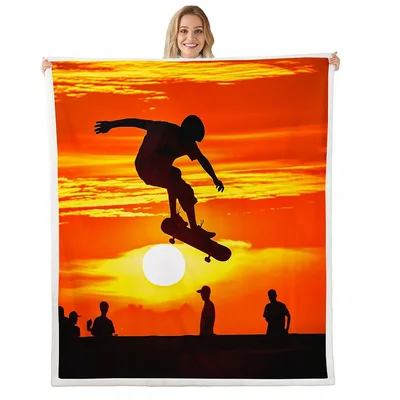 Skateboarder Silhouette at Sunset Blanket: Orange Sky Jump Design