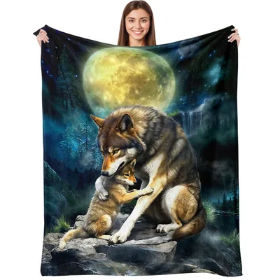 Wolf Under Full Moon Blanket featuring a protective adult wolf