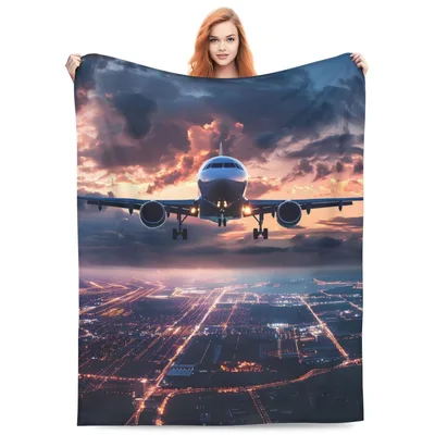 Airplane Landing at Sunset Blanket: Aerial View of Jet and City Lights