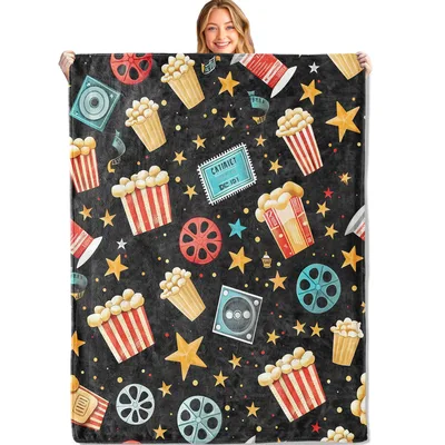 Midnight Cinema Stars Blanket features a movie theater